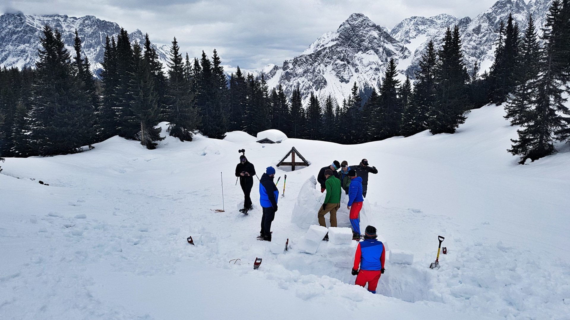 Adding the snow blocks to built an igloo in the Zugspitz Arena in Austria